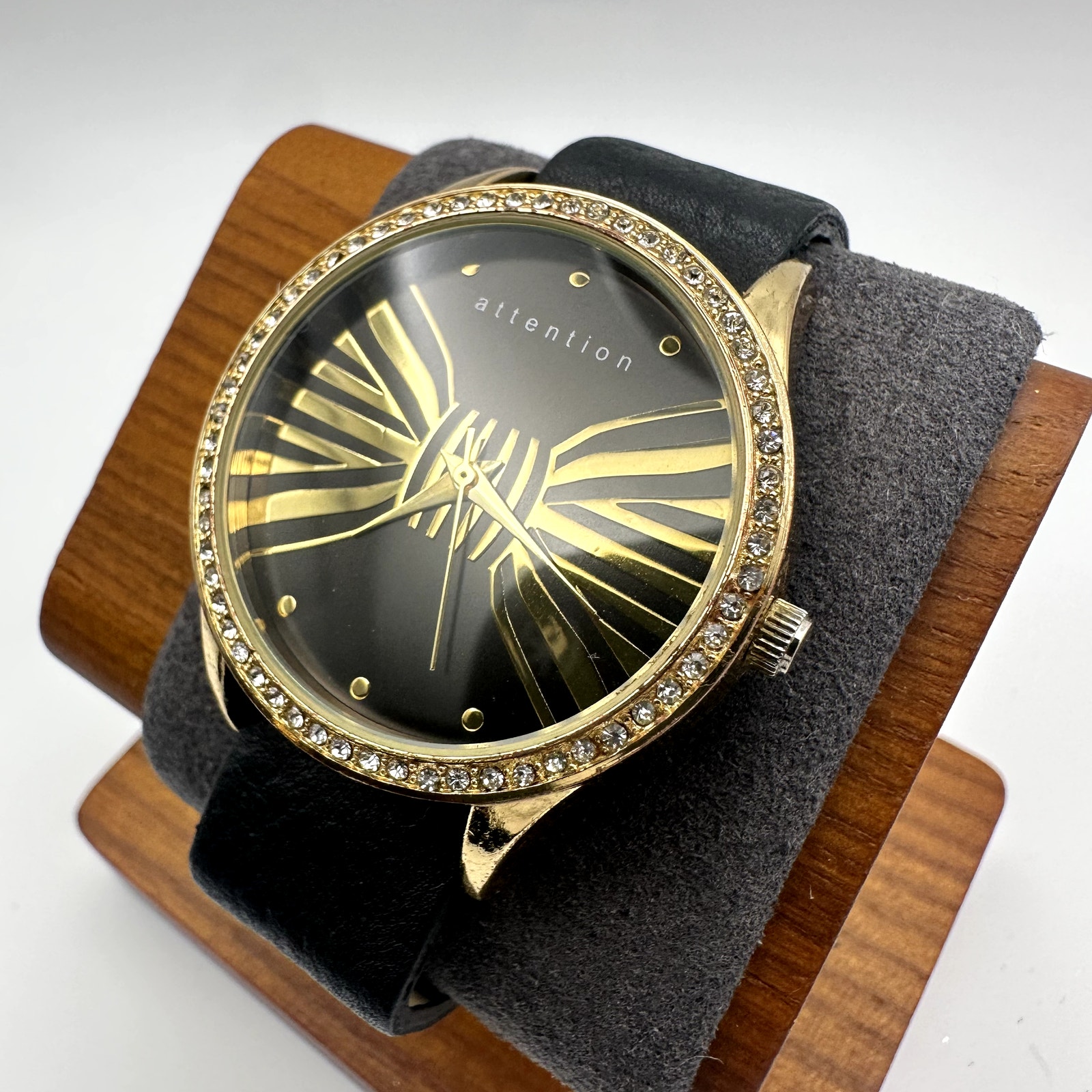 Attention GoldTone Black Dial Quartz Watch With Crystal Bezel